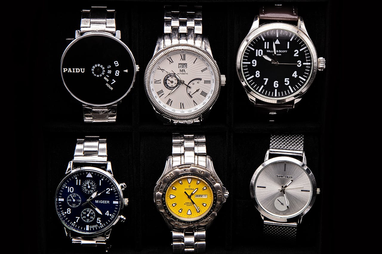 about-us-01 A variety of sophisticated wristwatches displayed against a dark background.